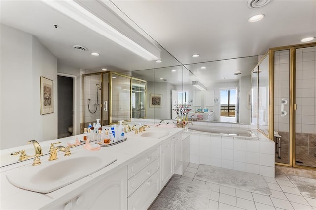2660 Peachtree Rd NW Unit 18G, Atlanta, GA 30305 - full bathroom featuring toilet, a shower stall, double vanity, a bath, and recessed lighting