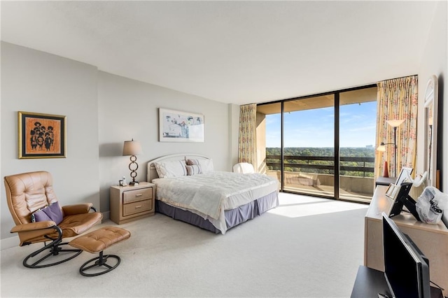 2660 Peachtree Rd NW Unit 18G, Atlanta, GA 30305 - bedroom with access to outside, light colored carpet, and a wall of windows