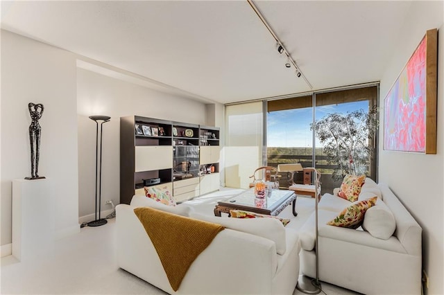 2660 Peachtree Rd NW Unit 18G, Atlanta, GA 30305 - living room with track lighting, baseboards, and floor to ceiling windows