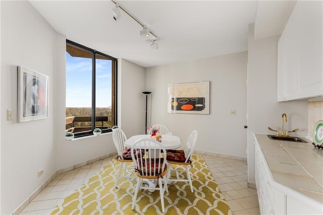 2660 Peachtree Rd NW Unit 18G, Atlanta, GA 30305 - dining area with track lighting and light tile patterned flooring