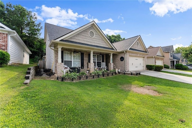 2691 Bald Cypress Dr, Braselton, GA 30517 - craftsman-style home with brick siding, covered porch, concrete driveway, an attached garage, and a front yard