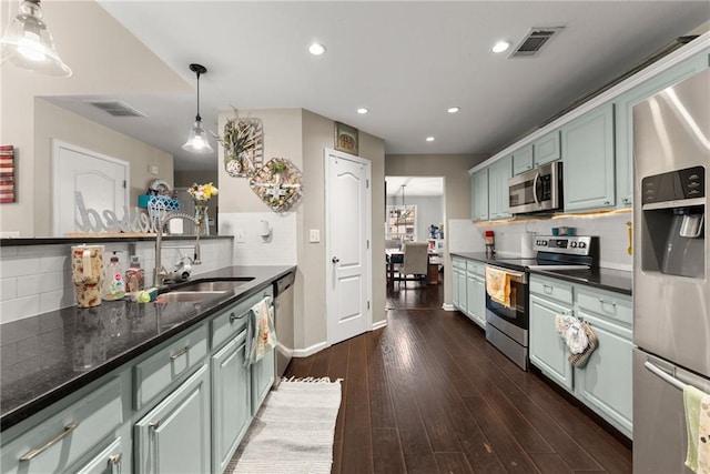 2691 Bald Cypress Dr, Braselton, GA 30517 - kitchen featuring stainless steel appliances, backsplash, recessed lighting, dark wood-type flooring, and pendant lighting