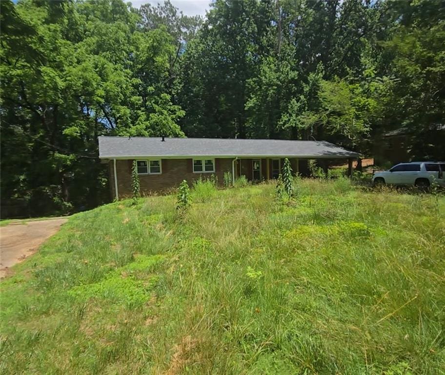 5533 Glore Dr SW, Mableton, GA 30126 - view of front facade featuring a wooded view