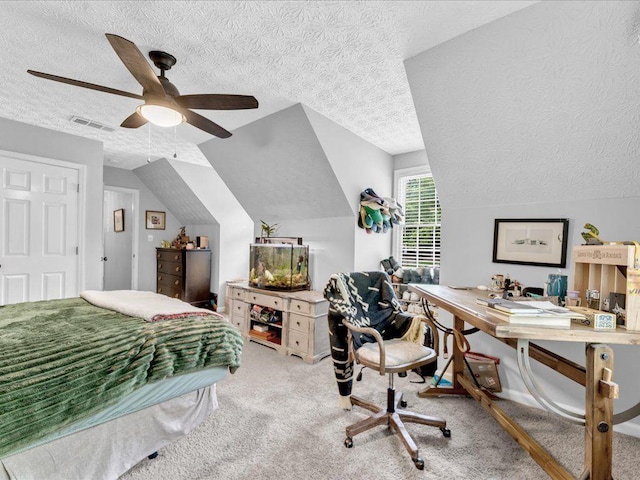 carpeted bedroom with a textured ceiling and lofted ceiling