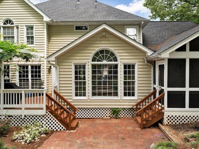 5625 Brookstone Dr NW, Acworth, GA 30101 - rear view of property with a shingled roof and a sunroom