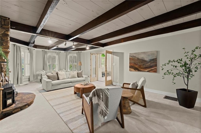 467 Liberty Grove Rd, Alpharetta, GA 30004 - living area featuring carpet floors, a wood stove, baseboards, and wood ceiling with exposed beams