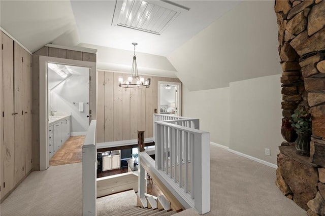 467 Liberty Grove Rd, Alpharetta, GA 30004 - hall featuring light colored carpet, an upstairs landing, lofted ceiling, wood walls, and baseboards