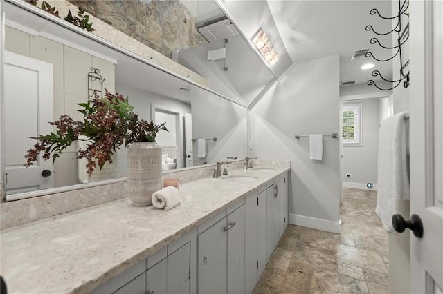 467 Liberty Grove Rd, Alpharetta, GA 30004 - full bathroom with baseboards, double vanity, and stone finish flooring