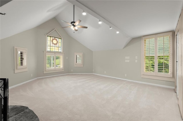 467 Liberty Grove Rd, Alpharetta, GA 30004 - additional living space featuring baseboards, lofted ceiling, ceiling fan, plenty of natural light, and light carpet