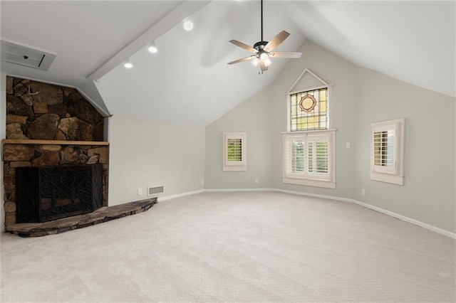 467 Liberty Grove Rd, Alpharetta, GA 30004 - unfurnished living room with vaulted ceiling, a ceiling fan, carpet floors, baseboards, and a stone fireplace