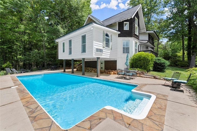 467 Liberty Grove Rd, Alpharetta, GA 30004 - swimming pool featuring a patio area and view of wooded area