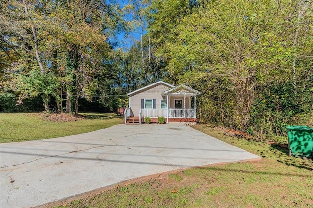 view of front of property with a porch and a front yard