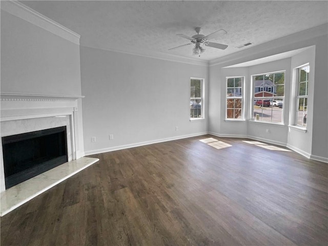 45 Hampton Dr, Cartersville, GA 30121 - unfurnished living room featuring a ceiling fan, wood finished floors, baseboards, ornamental molding, and a textured ceiling