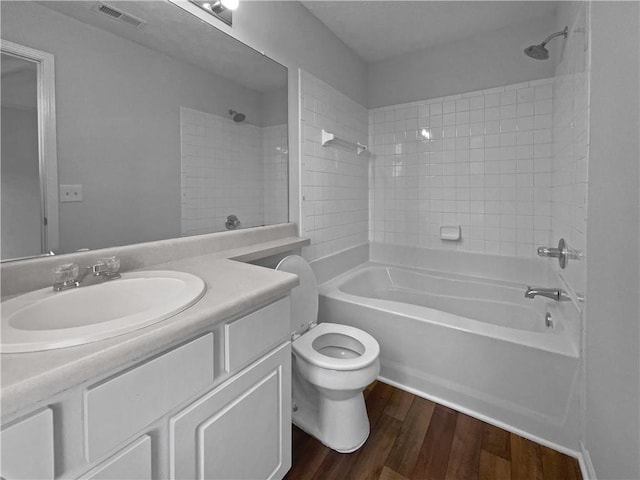 45 Hampton Dr, Cartersville, GA 30121 - bathroom with visible vents, toilet, bathing tub / shower combination, wood finished floors, and vanity