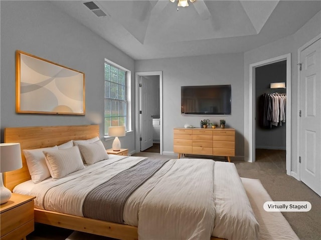 45 Hampton Dr, Cartersville, GA 30121 - bedroom with visible vents, a walk in closet, baseboards, carpet floors, and a raised ceiling