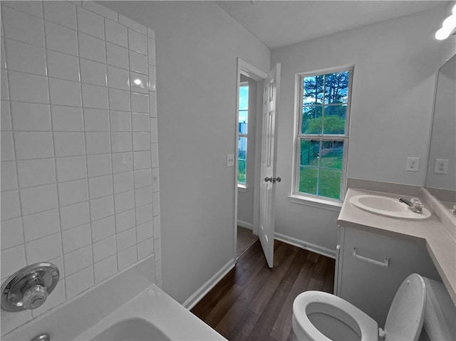 45 Hampton Dr, Cartersville, GA 30121 - bathroom featuring baseboards, toilet, wood finished floors, vanity, and  shower combination