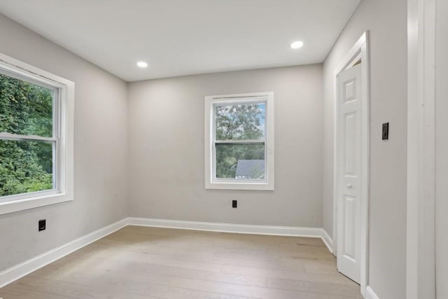 empty room featuring light hardwood / wood-style floors and a healthy amount of sunlight