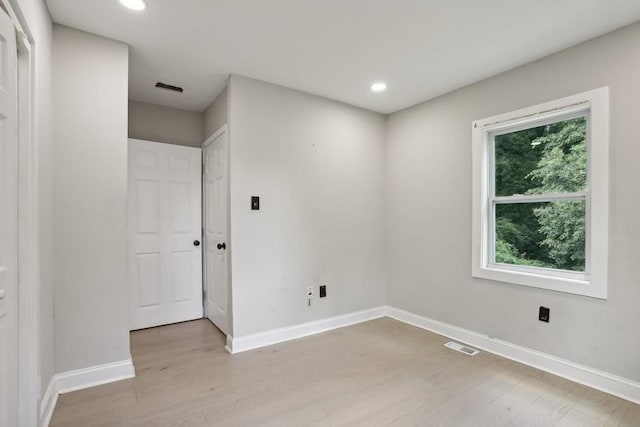 unfurnished room featuring light hardwood / wood-style flooring