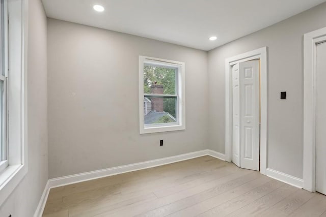 spare room with light wood-type flooring