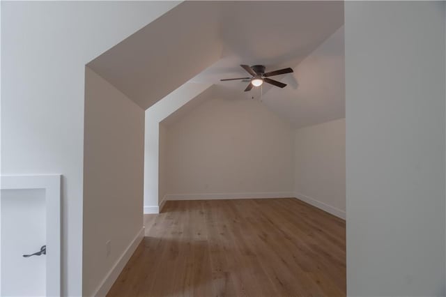 bonus room with ceiling fan, light wood-type flooring, and vaulted ceiling