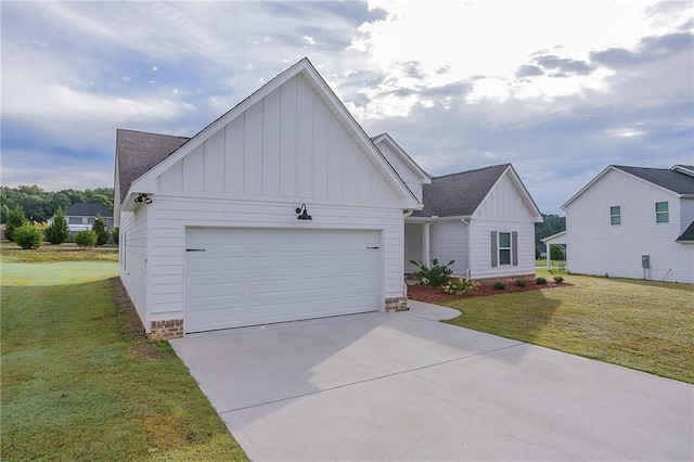 view of front facade with a front yard and a garage