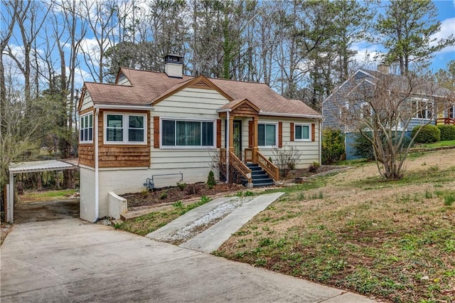 1747 Parkhill Dr, Decatur, GA 30032 - bungalow with a chimney, driveway, a carport, and roof with shingles