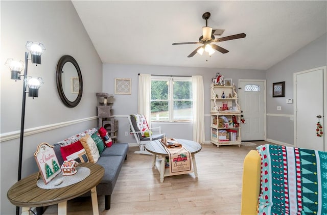 playroom with light hardwood / wood-style floors, ceiling fan, and vaulted ceiling