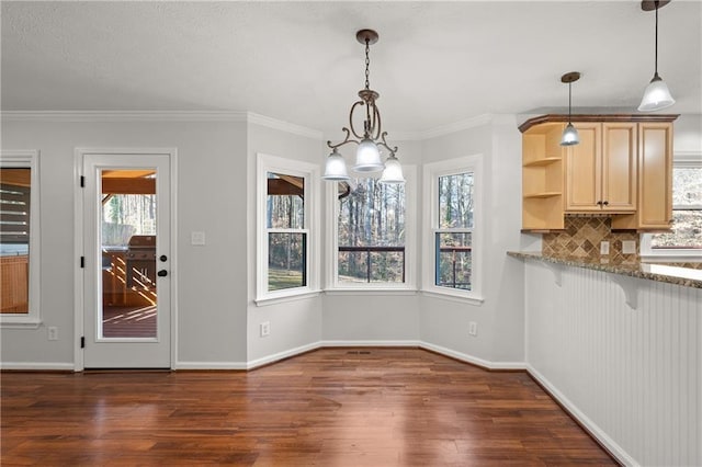 unfurnished dining area with dark wood-style floors and baseboards