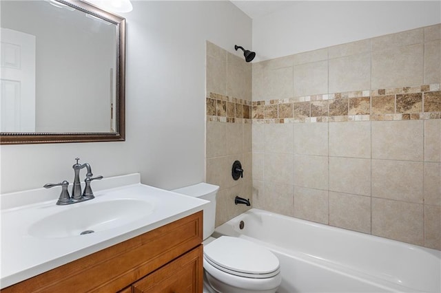 full bathroom featuring bathtub / shower combination, vanity, and toilet