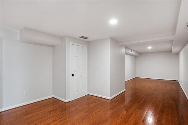 basement with hardwood / wood-style floors