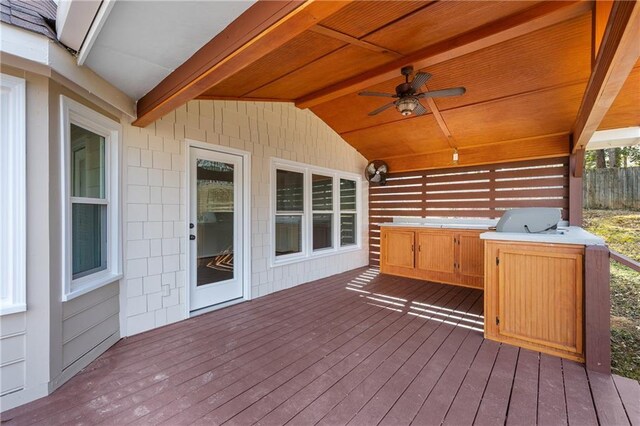 wooden deck featuring ceiling fan and grilling area