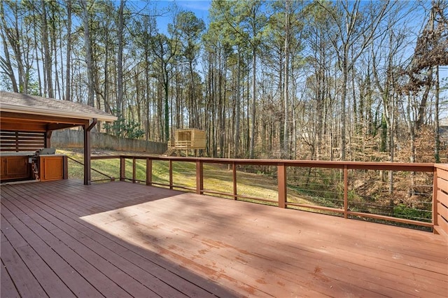 wooden terrace featuring fence