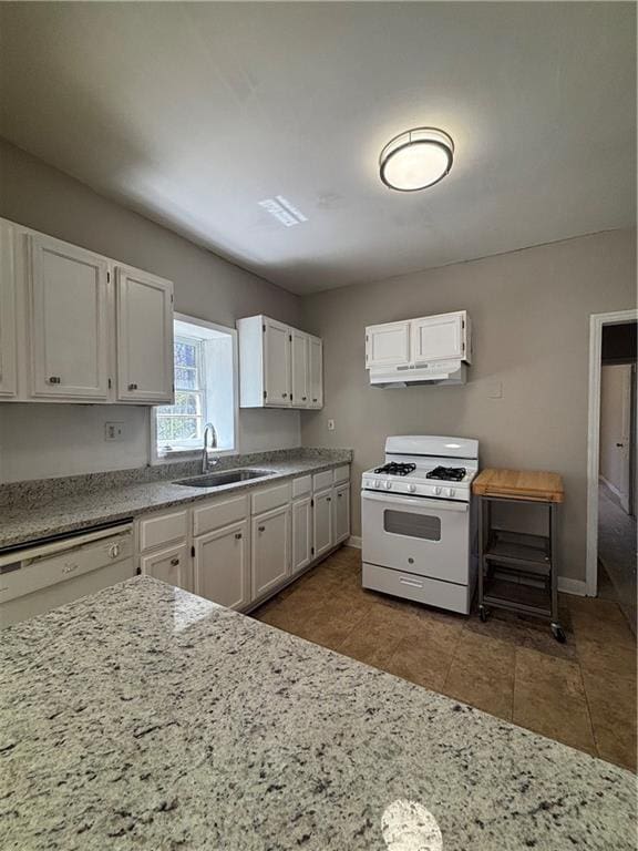 2103 River Rd, Ellenwood, GA 30294 - kitchen with white appliances, white cabinets, light stone counters, and under cabinet range hood