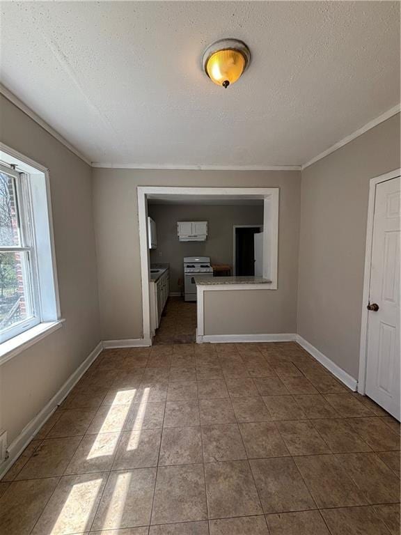 2103 River Rd, Ellenwood, GA 30294 - unfurnished living room featuring a textured ceiling, ornamental molding, and tile patterned floors