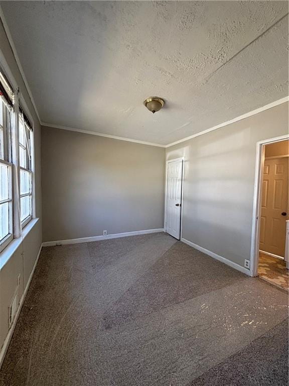 2103 River Rd, Ellenwood, GA 30294 - carpeted empty room with ornamental molding and a textured ceiling