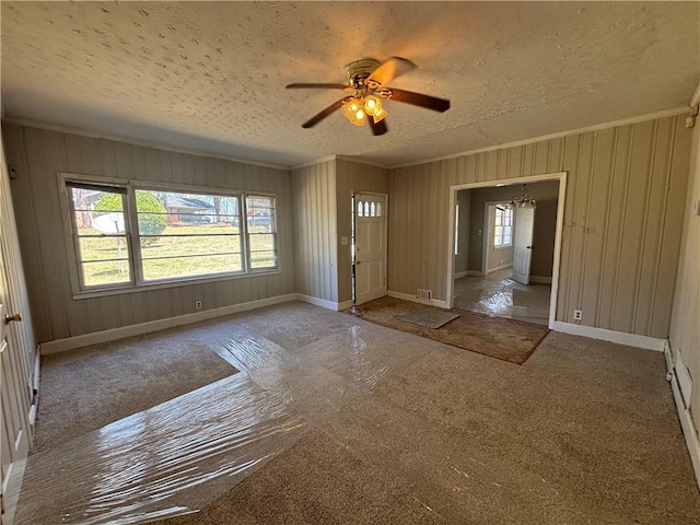 2103 River Rd, Ellenwood, GA 30294 - carpeted entryway featuring a textured ceiling, ornamental molding, and a ceiling fan