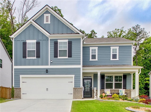 7730 Demeter Dr, Fairburn, GA 30213 - craftsman house featuring board and batten siding, a garage, driveway, a porch, and a shingled roof