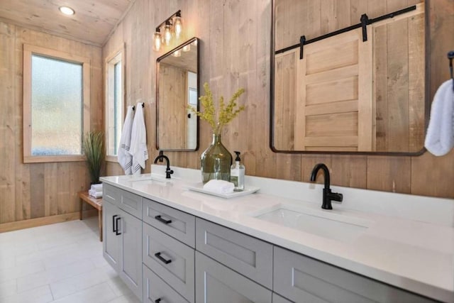 bathroom with vanity, wood ceiling, and wooden walls