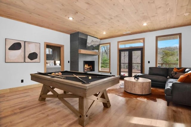 game room with a fireplace, billiards, french doors, wood ceiling, and light hardwood / wood-style flooring