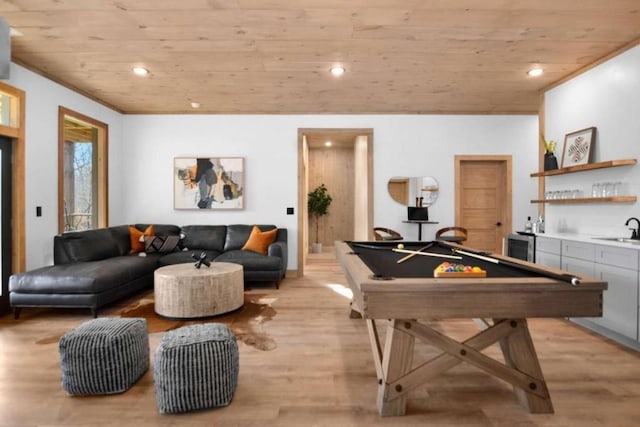 game room with pool table, wood ceiling, light hardwood / wood-style floors, and indoor wet bar