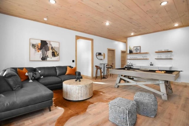 living room with sink, wood ceiling, and light wood-type flooring