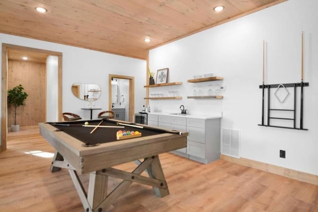 playroom featuring billiards, wooden ceiling, indoor wet bar, and light wood-type flooring