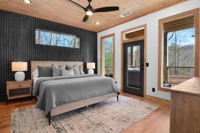 bedroom with wood ceiling, ceiling fan, and hardwood / wood-style flooring