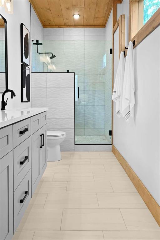 bathroom with toilet, an enclosed shower, wood ceiling, tile walls, and vanity