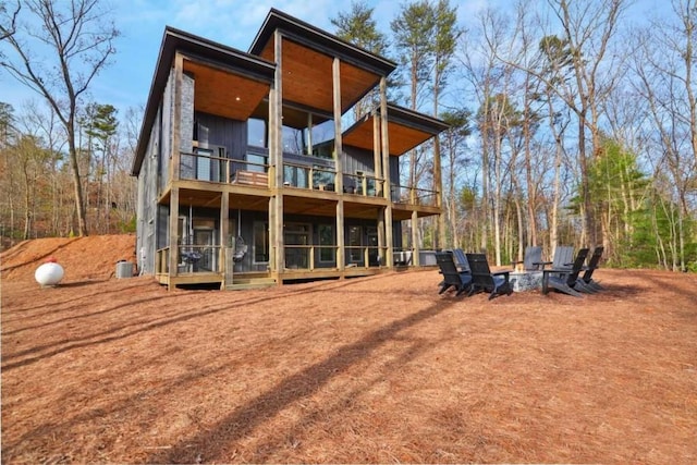 back of property featuring a balcony