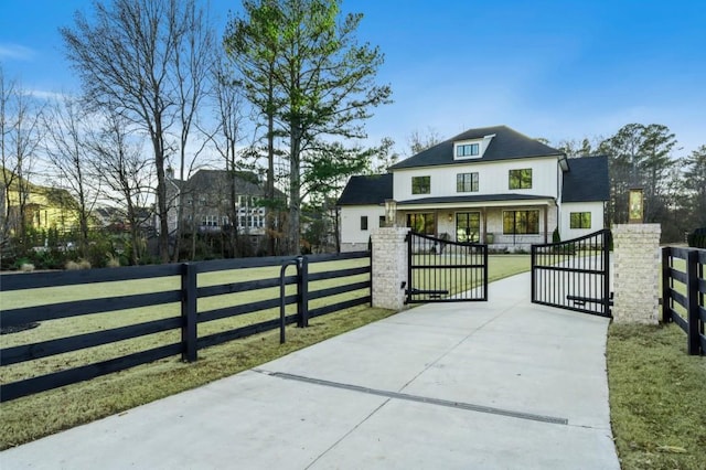 view of gate featuring a lawn