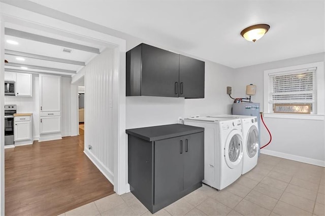 180 Kingston Highway 293 NW, Cartersville, GA 30120 - laundry area featuring independent washer and dryer, light tile patterned flooring, and baseboards