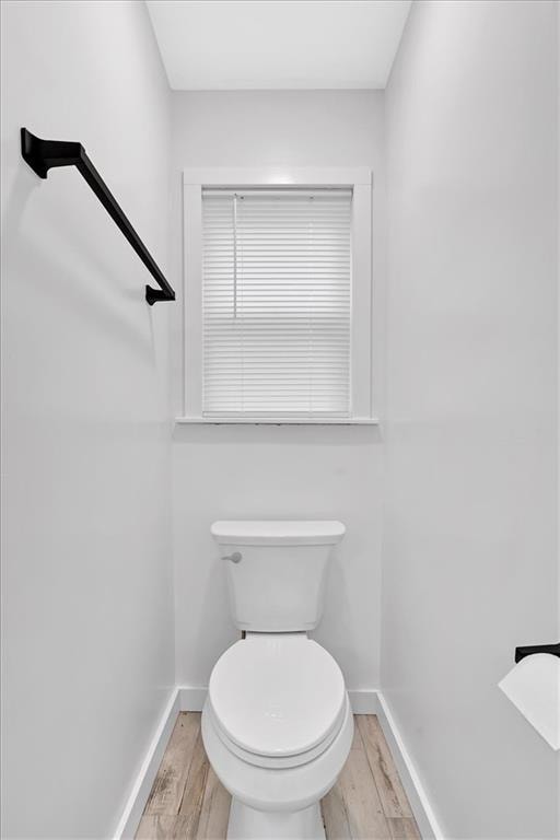180 Kingston Highway 293 NW, Cartersville, GA 30120 - bathroom featuring baseboards, wood finished floors, and toilet