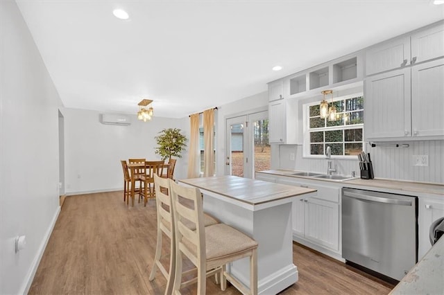 180 Kingston Highway 293 NW, Cartersville, GA 30120 - kitchen with stainless steel dishwasher, a sink, light countertops, light wood-style floors, and recessed lighting