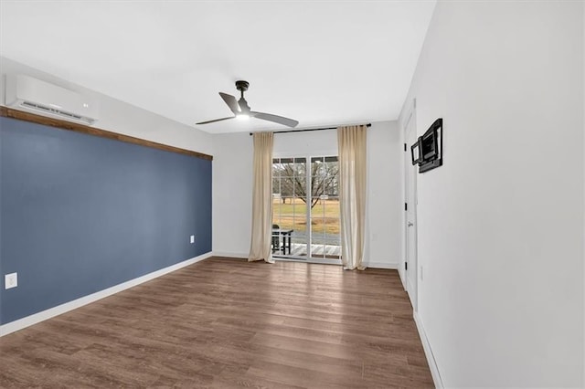 180 Kingston Highway 293 NW, Cartersville, GA 30120 - empty room featuring a wall mounted AC, ceiling fan, wood finished floors, and baseboards